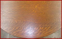 Partial table top displaying the excellent "quarter-sawn white oak grain with ample ray flake or "tiger oak" striping. (Light sopt of two of the images of the top are only the reflection from the camera flash. 